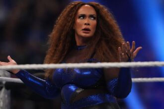 Niajax eats a shot of a brutal chair and gets bloody in WWE Smackdown
