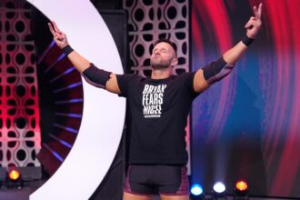 Nigel McGuinness fights FTR in a confused AEW collision main event with headphones removed