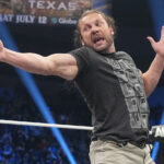 Kenny Omega holds the AEW International title to fight against Okada Okada at Fighter Fest