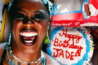 Naomi lets the razor blade slide onto the birthday cake for Jade Cargill in an intrusive video