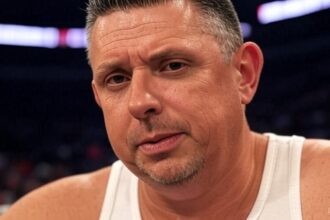 Why Michael Cole wears a tank top for upcoming WWEAR?