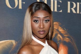 Aew's Queen Aminata appears to be shading former champion Britt Baker