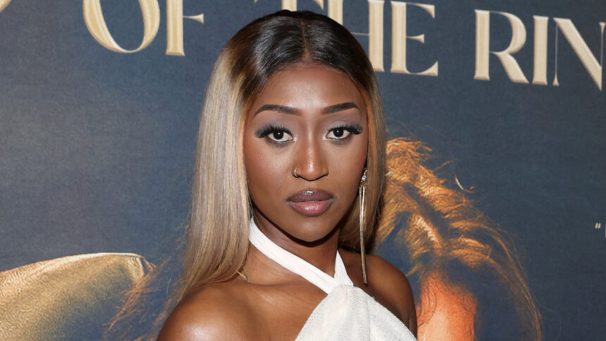 Aew's Queen Aminata appears to be shading former champion Britt Baker