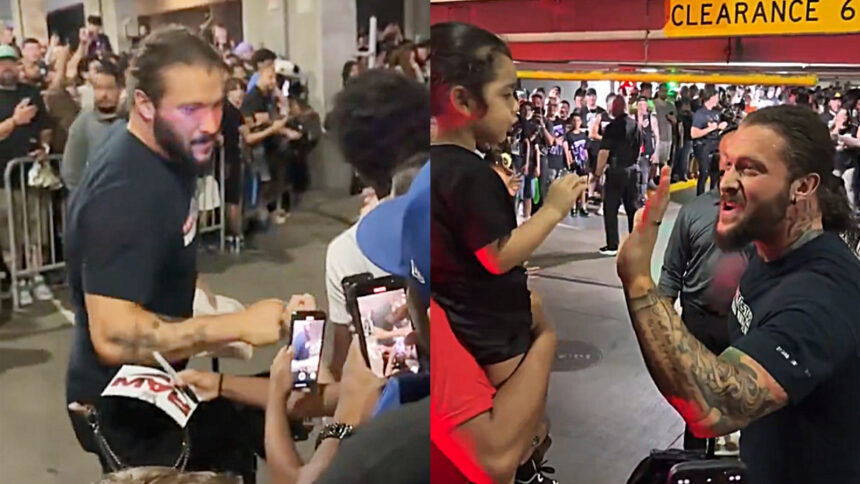 Fans gather behind Karrion Kross after the look of WWE RAW
