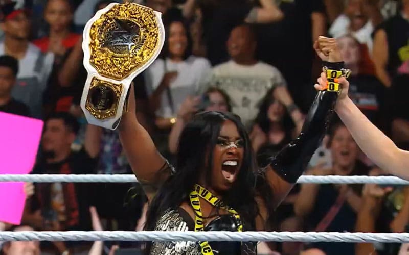 Naomi cashes with bank money to win the WWE Women's World Title with Evolution