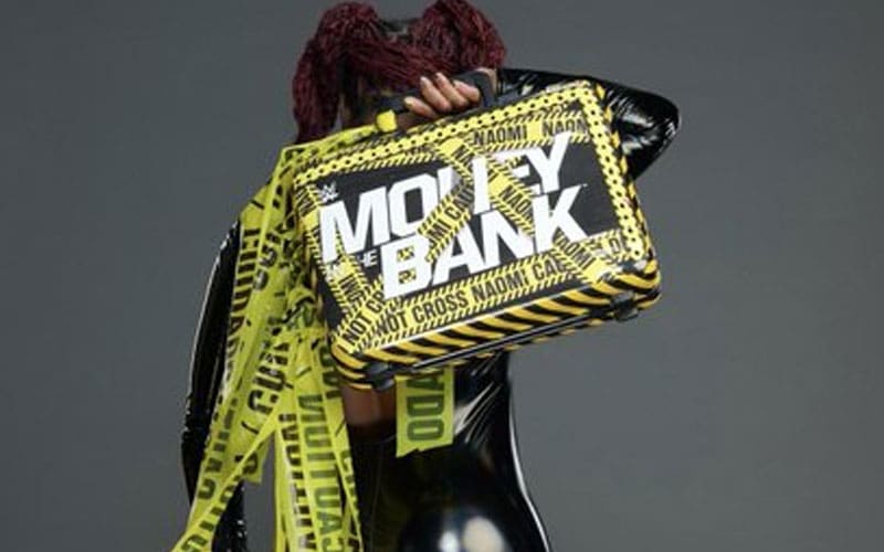Naomi reveals custom money in a bank briefcase after attacking Jade Cargill in WWE Smackdown