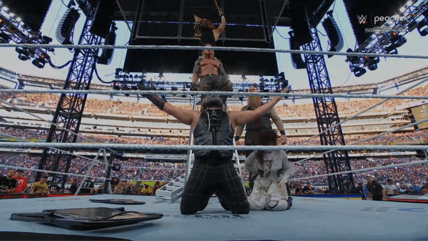 Wyatt Sids retains the WWE Tag Team Championship after a chaotic TLC Tag Team match