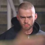 Austin Theory reveals he is WWE's masked man after RAW main event