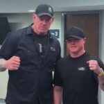 Canelo Alvarez poses with The Undertaker backstage at AAA Guerra de Titanes